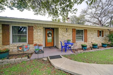 View of front facade featuring covered porch, sto