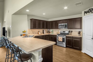 Beautifully maintained kitchen; fully equipped with stove/oven, microwave, dishwasher, and refrigerator