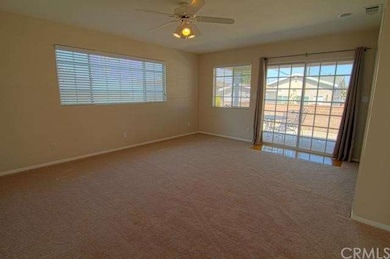 Master bedroom with sliders out to patio