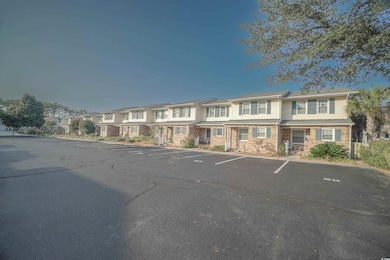 View of property with a residential view and uncov