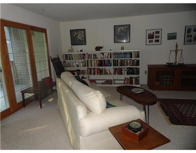 Living Room. French doors leading...