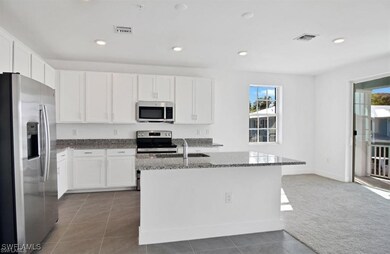 Kitchen featuring appliances with stainless steel