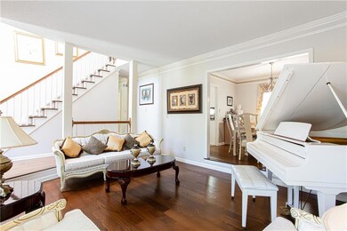 Living area featuring baseboards, wood finished fl