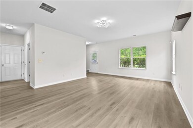 Empty room featuring light wood-style floors and baseboards