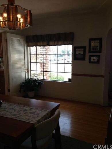 Dining room window looks out on to front porch - y