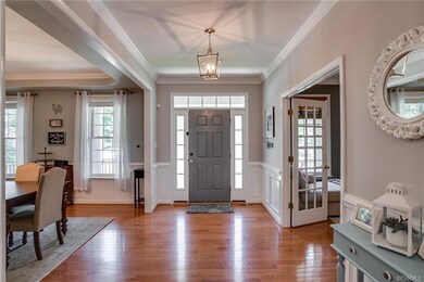 Enter into a stunning foyer with beautiful crown m