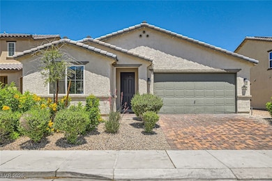 Mediterranean / spanish-style home with an attache