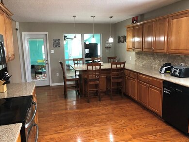 Kitchen open to breakfast area, dining & living ro