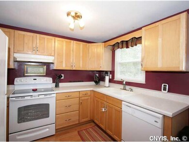 Kitchen. Newer appliances, laminate floor and maple cabinets.