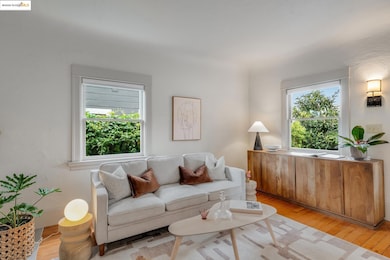 Living area featuring light wood-type flooring and plenty of natural light