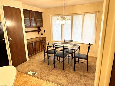 Tiled dining space with a wealth of natural light