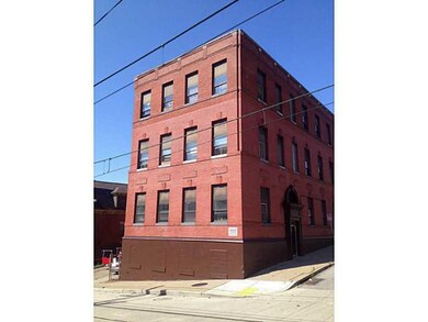 Exterior Front. View from corner of warrington ave