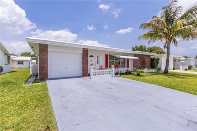 View of front facade with an attached garage, a fr