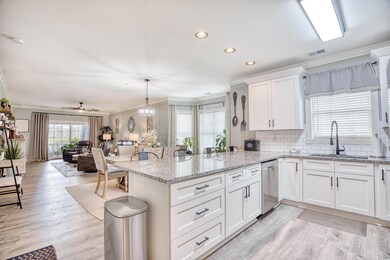 Kitchen with sink, ornamental molding, white cabin