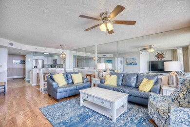Living room with a textured ceiling, ceiling fan, 