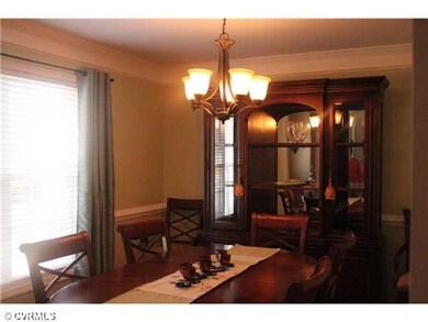 Dining Room - With hardwood floor, crown molding a