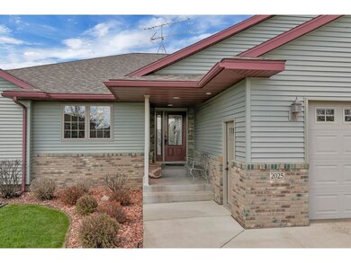 Covered front entry with recessed lighting and two
