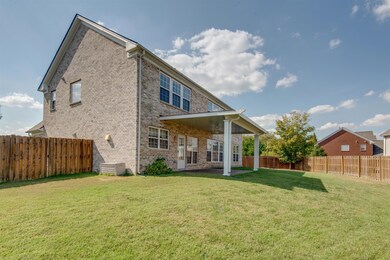 Huge, fenced in backyard with covered patio