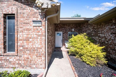 Doorway to property featuring central AC unit
