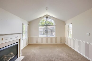 A gas fireplace warms the space.