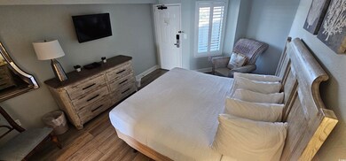 Bedroom featuring dark hardwood / wood-style floor