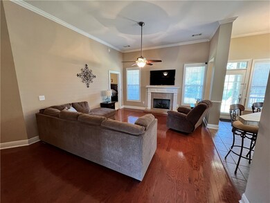 Inviting living area with quaint fireplace for tho