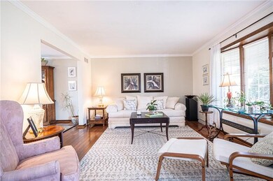 LIVING ROOM ON MAIN LEVEL WITH LOTS OF NATURAL LIG
