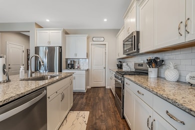 The kitchen has a very large pantry and a gas range.
