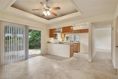 Beautiful dining area with trey ceiling.  New slid