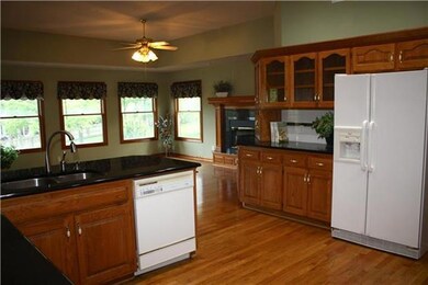 Wide open floor plan with wood flooring and cozy h