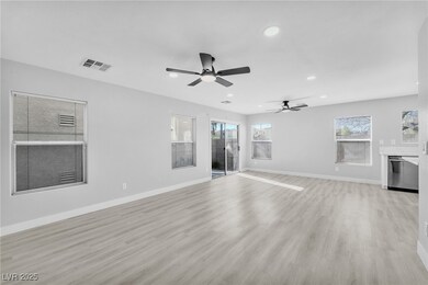 Unfurnished living room featuring baseboards, rece