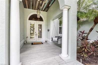 Big Beautiful entry with porch swing and decorative wood stained ceilings.