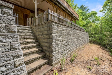 $60K improvement....beautiful stone retaining wall off rear covered terrace
