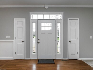 Sunny welcoming and large entry!  2 coat closets to the left and the right of the door.