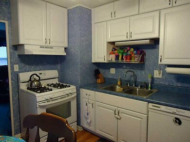 Kitchen. Includes gas stove, dishwasher, and dispo