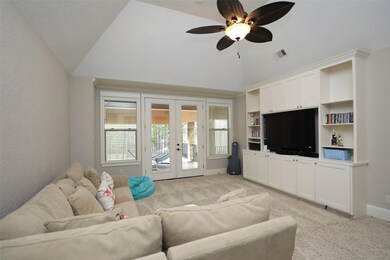 Kids game room area with covered balcony access