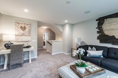 Living room with recessed lighting, baseboards, an