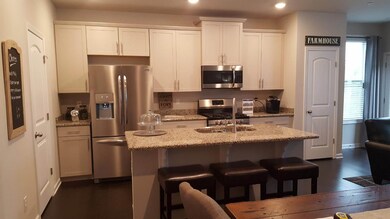 Lots of cabinets and island seating.  Granite and SS appliances.  All photos of another home.  Finishes will vary.