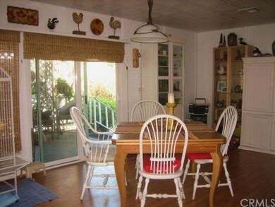 Family Room with Glass Sliders out to Porch and Re
