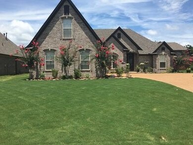 This home is accented with a low maintenance brick
