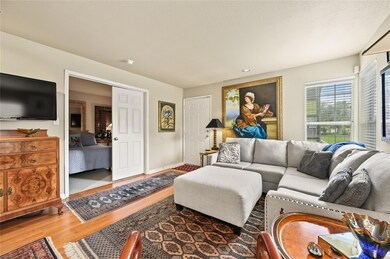 Living room featuring baseboards, recessed lighti