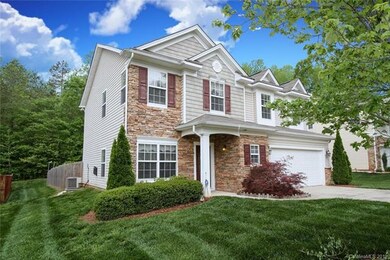 Elegant partial stone veneer and easy care siding provides a picture-perfect entry