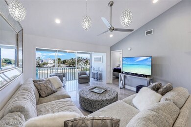 Living room with plenty of natural light, ceiling fan, recessed lighting, and high vaulted ceiling
