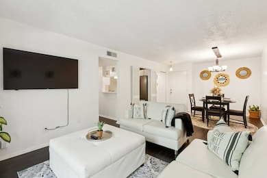 Another view of the open living-dining concept showcases the flexibility of the space. Whether you're hosting a dinner party or enjoying a quiet night in, this floor plan fits every lifestyle.