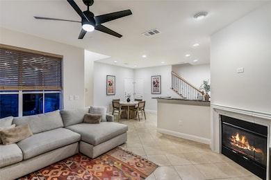 Living room with light tile patterned floors, a c