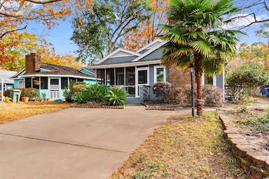 View of front of home with a sunroom