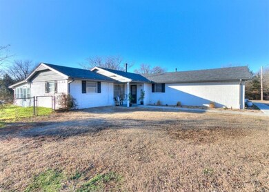 Single story home featuring a front lawn