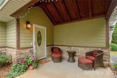 Front porch with cathedral wood beam ceiling