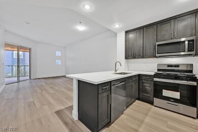 Kitchen featuring stainless steel appliances, ligh