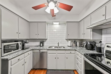 Kitchen featuring sink, light hardwood / wood-styl
